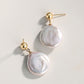 Elegant Statement Stud Earrings for Women with Irregular Pearl and Silver Design